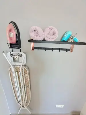 a shelf with two donuts on a wall at PoP Kitty Octagon Premium Ipoh Town Center 2BR by Grab A Stay in Ipoh