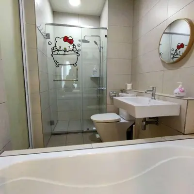 a bathroom with a shower and a toilet and a sink at PoP Kitty Octagon Premium Ipoh Town Center 2BR by Grab A Stay in Ipoh