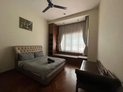 a bedroom with a bed with a cat sitting on it at Perfect Marina Stay @ Strait Quay 6 Pax Max in Bagan Jermal