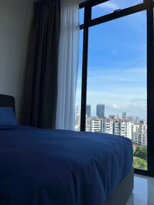 a bedroom with a blue bed and a large window at Beacon Executive Suites #Georgetown #RoofTopPool #10 in George Town