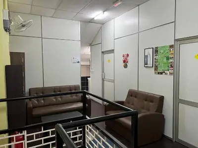 two empty chairs in a hospital room with a hallway at De Cameron Guest House in Tanah Rata