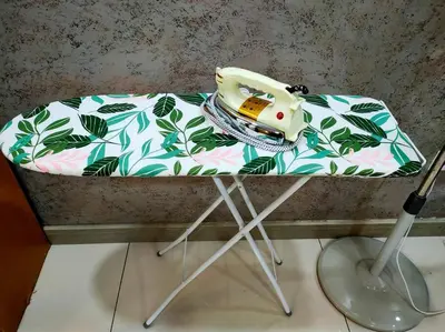 a table with a sewing machine on top of it at 678 homestay 4 room 5 minutes to tower in Teluk Intan