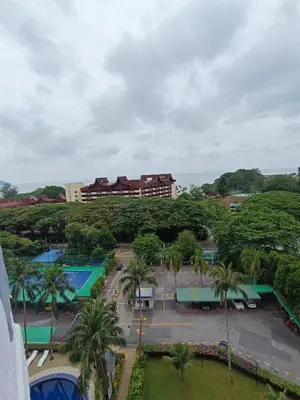 an overhead view of a park with palm trees and buildings at Lovers Island homestay in Batu Ferringhi