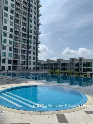 a large swimming pool in front of some tall buildings at SM Homestay @ Meru Casa Kayangan in Ipoh
