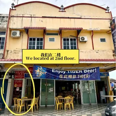 a building with a sign that says we located at and floor at Hotel Langkap LW \u51b7\u7532\u9152\u5e97 in Kampung Degong