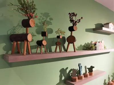 a shelf with vases and plants on a wall at Emerald Avenue Cozy 3R3B Apartment - 329 in Brinchang