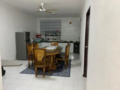a kitchen and dining room with a table and chairs at AlFarizqi Muslim Residence SP in Sungai Petani