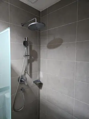 a bathroom with a shower with a shower head at The MINDI, 2BR Cityview by WStay @ Tropicana 218 Macalister in George Town