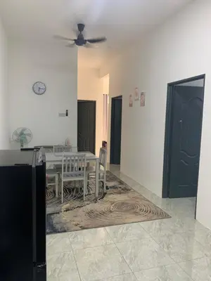 a dining room with a table and a ceiling fan at Bonda Homestay Selama - Musllim Only in Selama