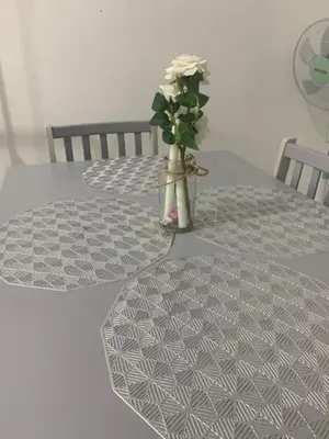 a vase with a white rose sitting on a table at Bonda Homestay Selama - Musllim Only in Selama