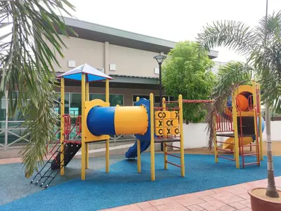 a playground in front of a building at Cosy Apartment Ipoh Town - WiFi Netflix FREE in Ipoh