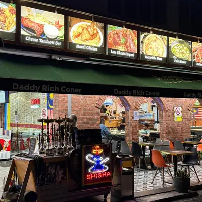 a fast food restaurant with signs on the wall at 6PAX ONE BEDROOM SOHO near USM SPICE ARENA PANTAI SPECIALIST AIRPORT in Bayan Lepas