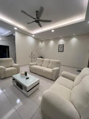 a living room with couches and a coffee table at Entire Vacation Home with landscape garden in Sitiawan