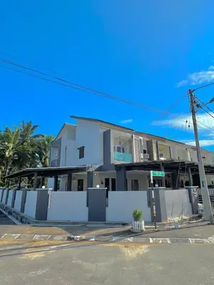 a white building with a fence in front of it at Entire Vacation Home with landscape garden in Sitiawan