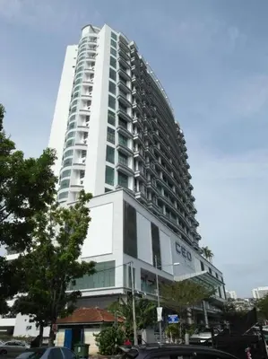a tall white building with cars parked in front of it at 4PAX near USM n Pantai Hospital n PISA SPI CE ARENA in Bayan Lepas