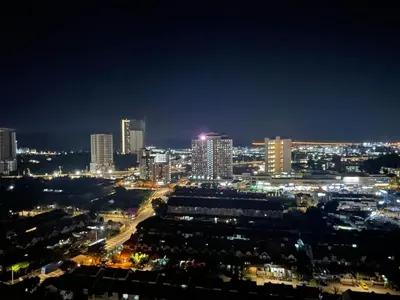 a view of a city at night with lights at 6PAX NEAR USM n PANTAI HOSPITAL n SPI CE ARENA in Bayan Lepas