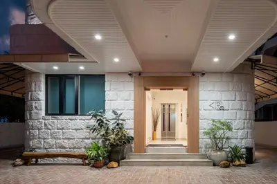 a lobby of a house with a bench and plants at Codrington House - Boutique Apartments in George Town