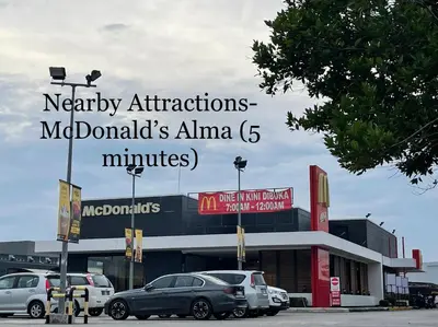 a mall with cars parked in a parking lot at Cozy24#4pax#wifi&netflix#NearAeonAlma#Heritage in Bukit Mertajam