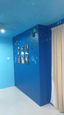 a room with a blue wall with planets and curtains at Setia Residen Semi-D two half storey 5 Bedrooms unlimited wifi in Sitiawan