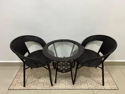 three black chairs sitting on top of a rug at HASSMA Studio Apartment at Kompleks Mutiara GM in Gua Musang