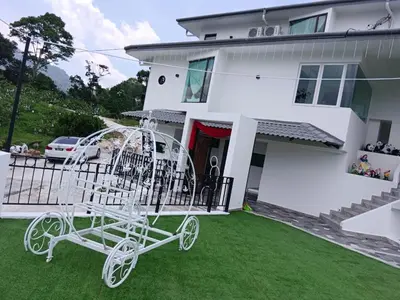 a white carriage in front of a house at I Do Farmstay in Bukit Mertajam