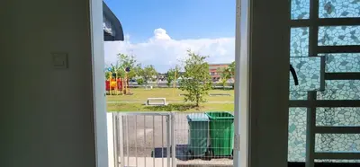 a view of a park from a window at Bertam Homestay Kepala Batas in Kepala Batas