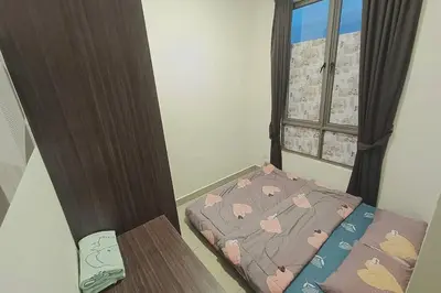a small bed in a room with a window at Freezing Point Homestay @ Palas Horizon Residence in Cameron Highlands