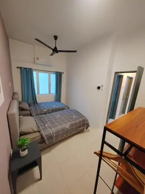 a living room with a bed and a couch at Casa Apartment @ Ipoh \u3010\u6021\u4fdd\u6c11\u5bbf\u3011 in Ipoh
