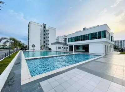 a swimming pool in front of a building at Casa Apartment @ Ipoh \u3010\u6021\u4fdd\u6c11\u5bbf\u3011 in Ipoh