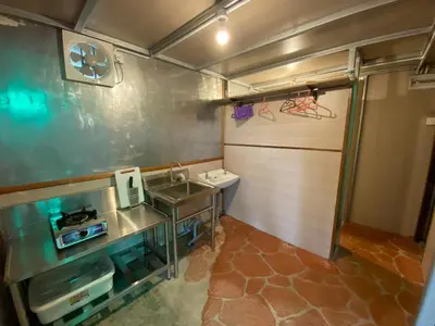 a small bathroom with a sink and a counter at New Farmer Hut 2 in Brinchang