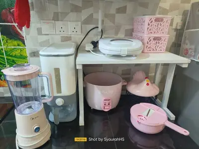 a table with a blender and other appliances on it at Syaurah Homestay Bagan Serai Dua Tingkat 4 Bilik in Bagan Serai