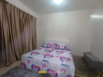a bedroom with a bed with pink flamingos on it at Syaurah Homestay Bagan Serai Dua Tingkat 4 Bilik in Bagan Serai