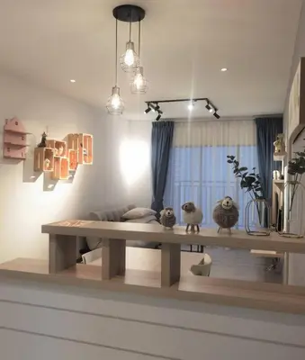 a table in a living room with two stuffed animals at Emerald Avenue Cozy 1BR Studio Suite in Brinchang