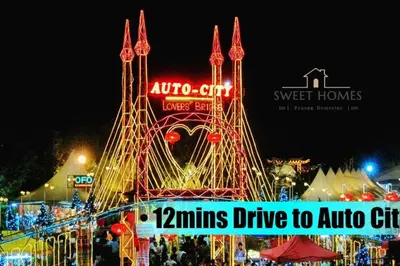 a carnival ride with a sign in the night at Blue Studio Suite 1-4pax B'Worth Prai@SwimmingPool in Perai