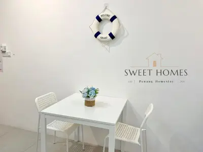 a white table with chairs and a soccer ball on a wall at Blue Studio Suite 1-4pax B'Worth Prai@SwimmingPool in Perai