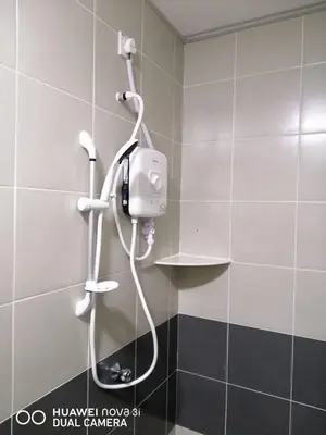 a shower in a bathroom with a phone on the wall at Alyaleesya homestay Emerald Avenue 1 Brinchang in Brinchang
