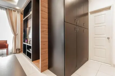 a kitchen with a stainless steel refrigerator and a pantry at Mansion One Executive Studio 2pax in George Town