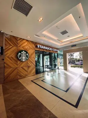 a shopping center with a starbucks sign on the wall at Mansion One l 4pax Studio l Cityview l Gleneagle l by PerfectSweetHome in George Town