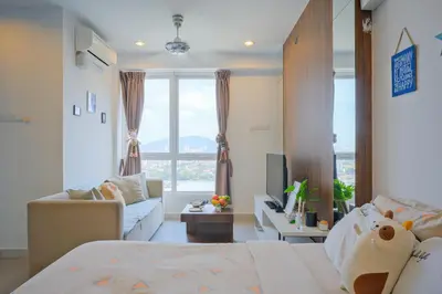 a living room with a bed and a couch and window at Mansion One l 4pax Studio l Cityview l Gleneagle l by PerfectSweetHome in George Town