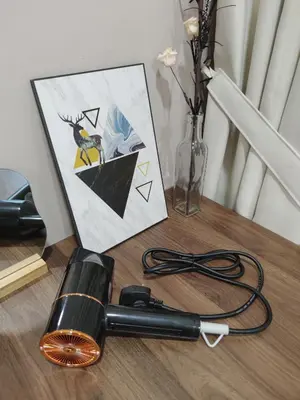 a hair dryer sitting on a table next to a picture at IPOH Waterpark Homestay By SummerStay 5km to IPOH TOWN in Ipoh