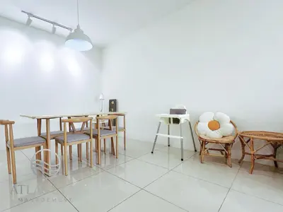 a dining room with wooden chairs and a table at IPOH Waterpark Homestay By SummerStay 5km to IPOH TOWN in Ipoh