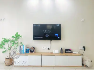 a flat screen tv hanging on a wall at IPOH Waterpark Homestay By SummerStay in Ipoh