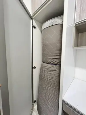 an empty closet with a bed in a room at Lily King (modern and comfy) in Tanah Rata