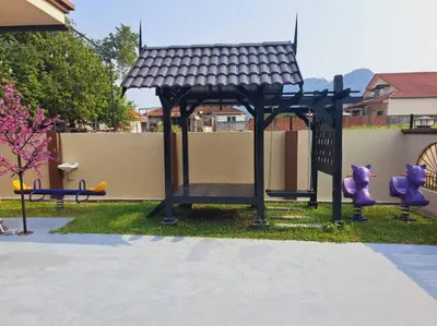a playground with a gazebo in a yard at Cs Villa Homestay in Ipoh