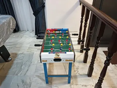 a pool table sitting on the side of a staircase at Cs Villa Homestay in Ipoh