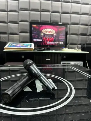 a microphone sitting on top of a glass table at Manjung Vermogen Stay-Wi-Fi+KTV(Near Aeon) in Sitiawan