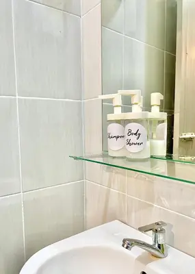 a bathroom with a sink and a mirror at Homestay Akasia 12 in Seri Iskandar