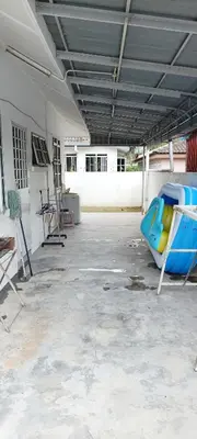an empty parking lot with a blue and yellow slide at Single Storey Bungalow 12 pax in Ipoh