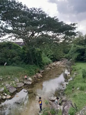 a group of people standing in a river at Simple Home Taiping \u7b80\u5c45 @ Suria Aman in Kamunting