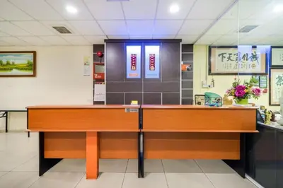 a reception desk in a hospital room at Hotel River Inn in Butterworth